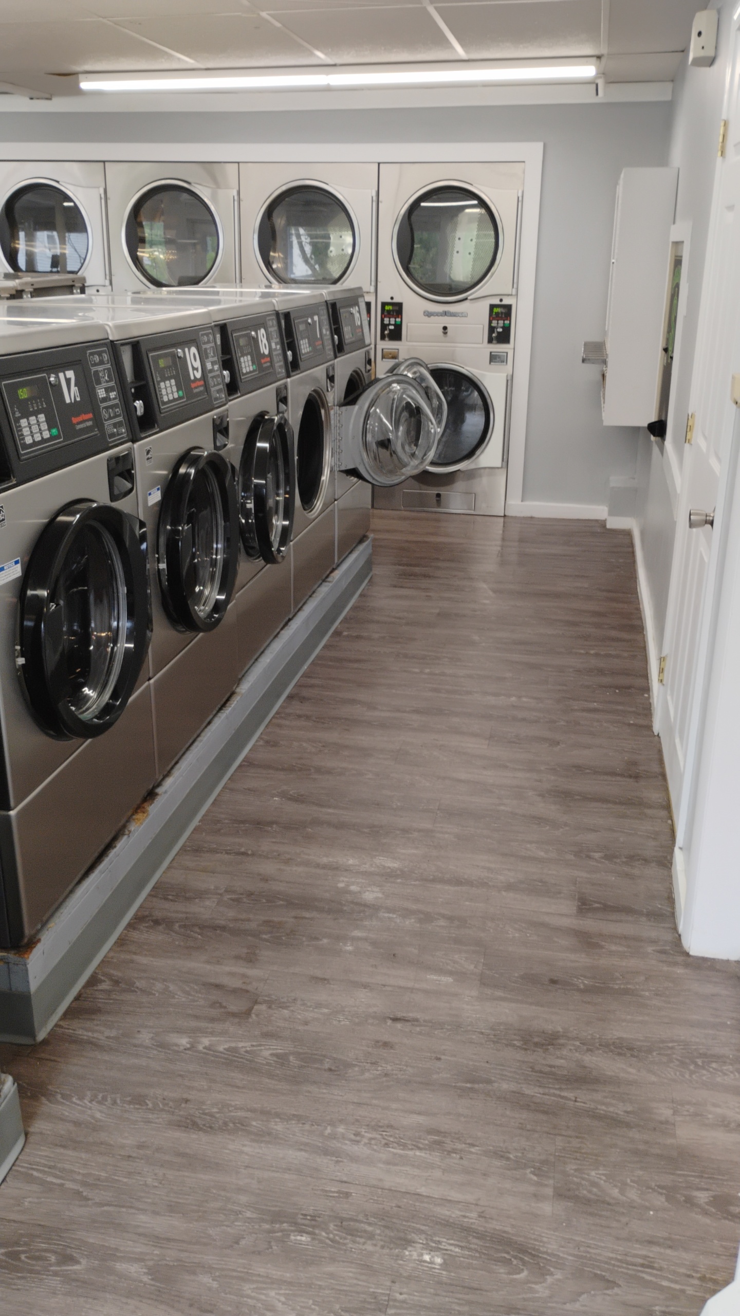 Commercial dryers inside Monument Laundromat