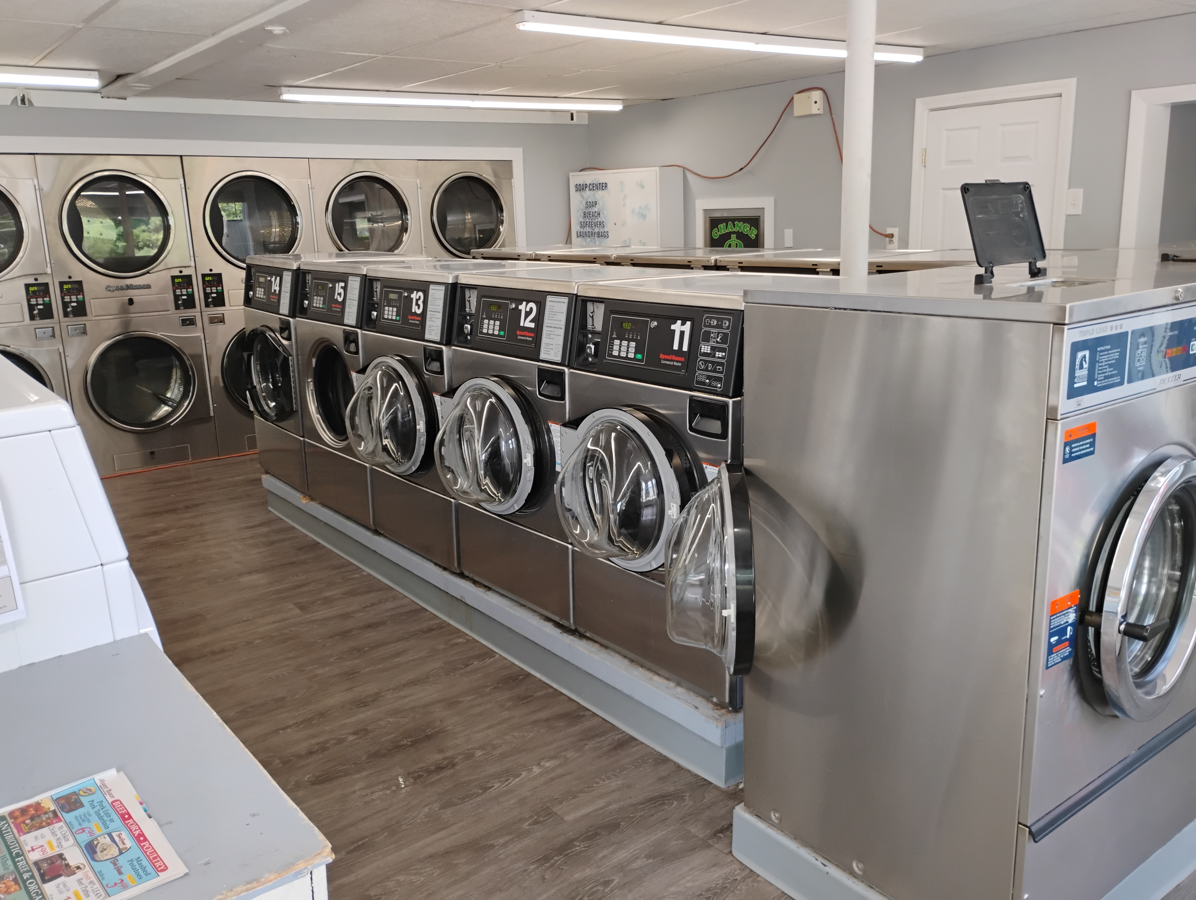 Interior of Monument Laundromat with rows of commercial washing machines