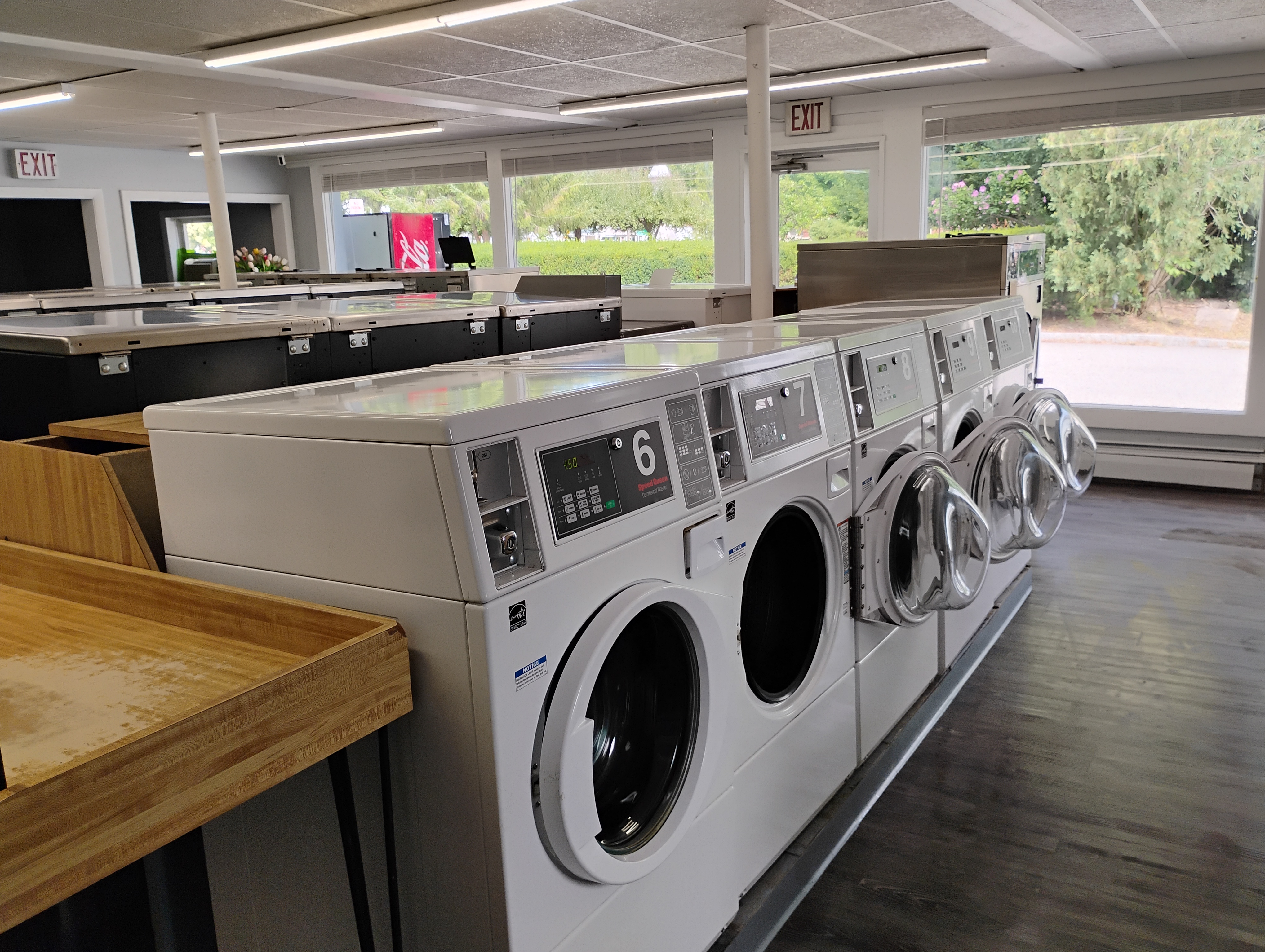 Bright laundromat interior with washing machines